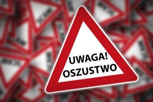 Napis &quot;Uwaga oszustwo&quot;.